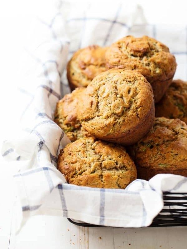 Honey and Olive Oil Zucchini Muffins - hard to believe these sweet, moist, jumbo puffy muffins are healthier with whole wheat, olive oil, and no refined sugar! 280 calories. | pinchofyum.com