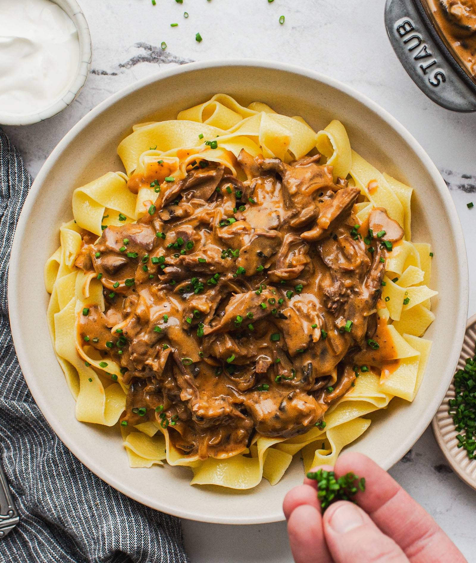 Beef stroganoff in a bowl with egg noodles.
