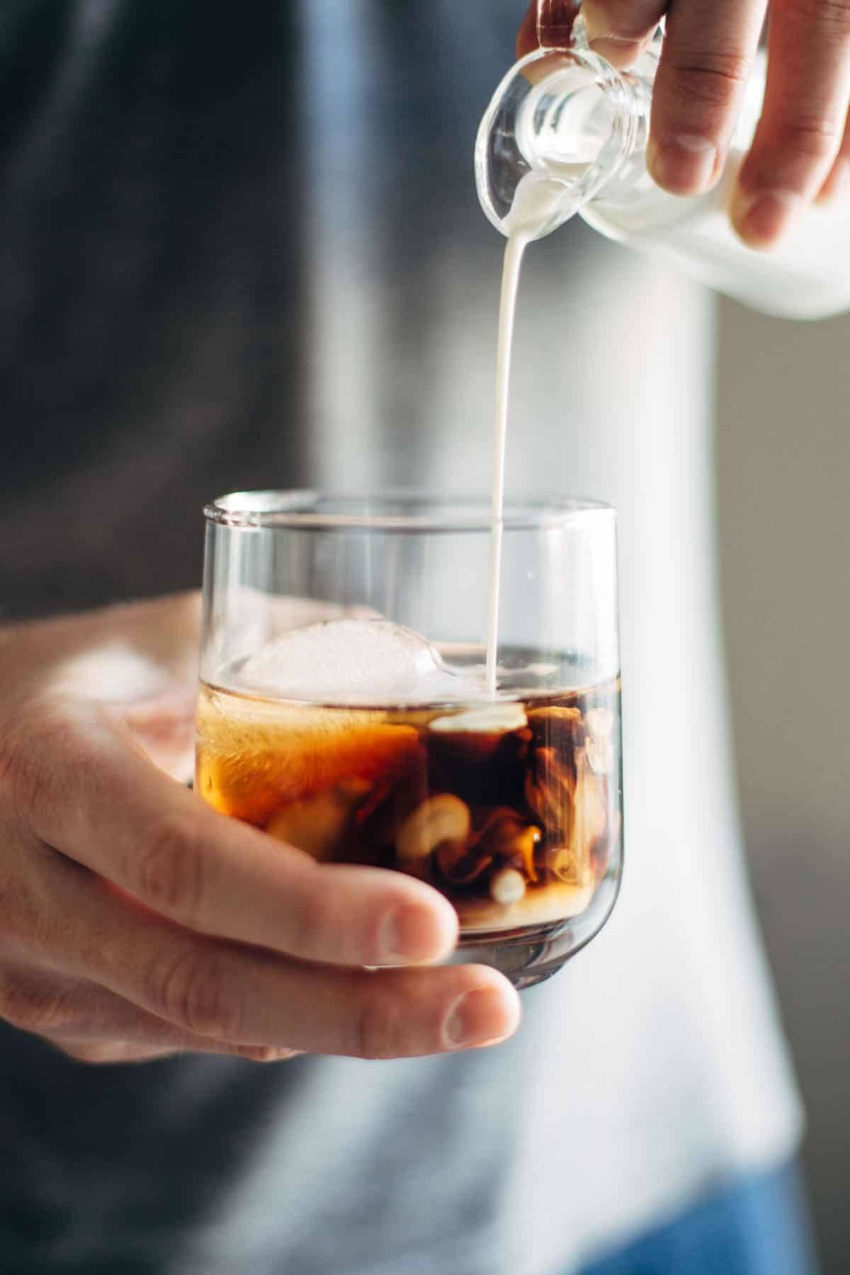 This Cinnamon White Russian is a perfect holiday party drink! with just four ingredients - vodka, coffee liquor, cinnamon simple syrup, and cream. | pinchofyum.com