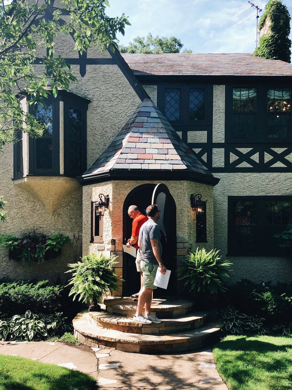 Bjork in front of house.