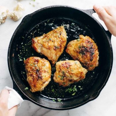 Honey Lemon Chicken in a cast iron pan.