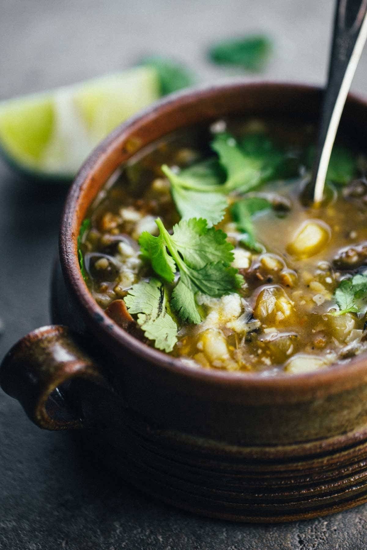 Soup with herbs in a bowl.