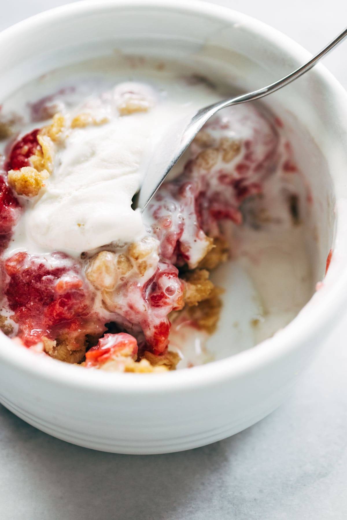 Taking a bite of raspberry crumble.